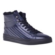 Trainers in dark blue quilted leather and leather